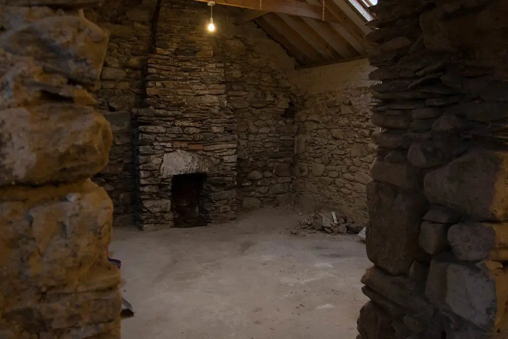 Stone fireplace in an Irish cottage