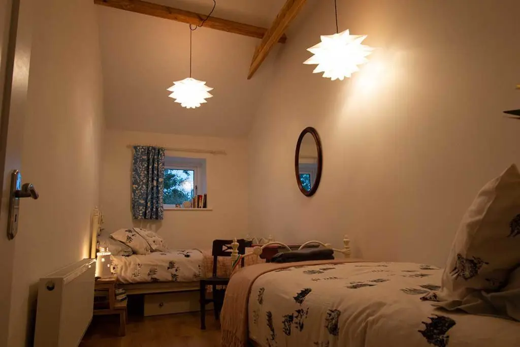 The long bedroom ready for guests