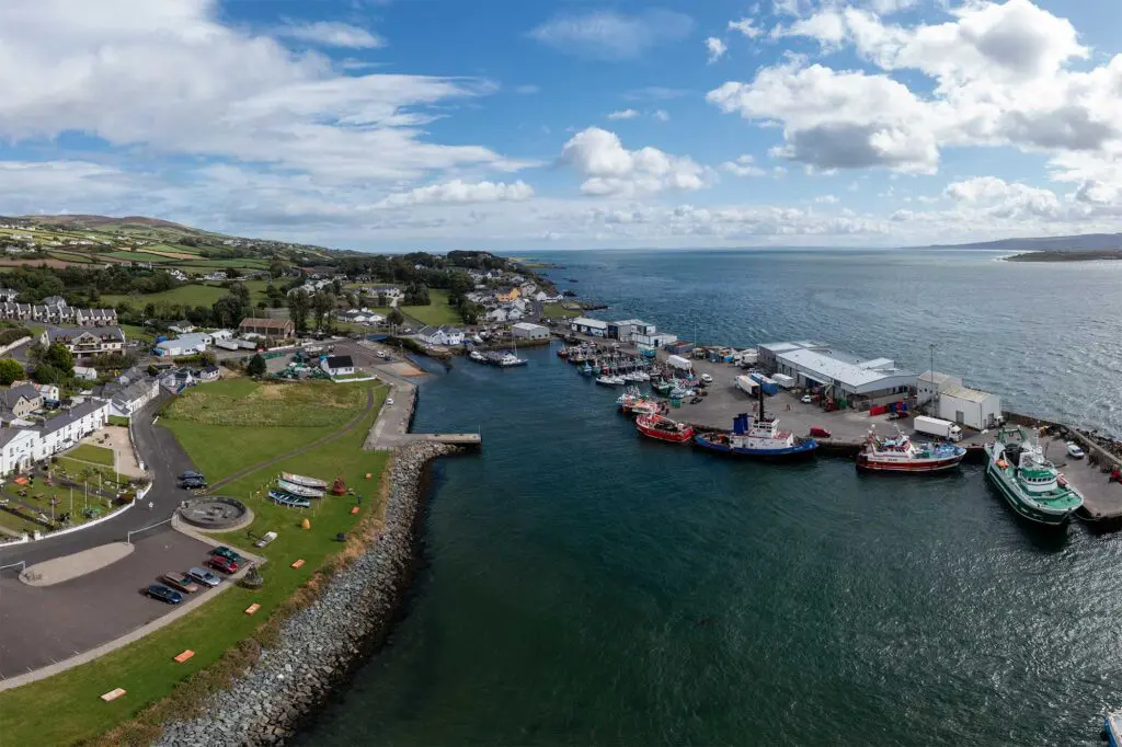 An aerial view of Greencastle Harbour with Lough Foyle and Northern Ireland in the background