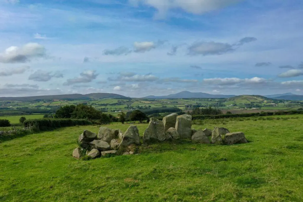 The Temple of Deen - a wedge tomb with hills in the distance