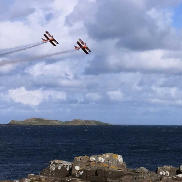 Two old biplanes flying in Portrush Airshow