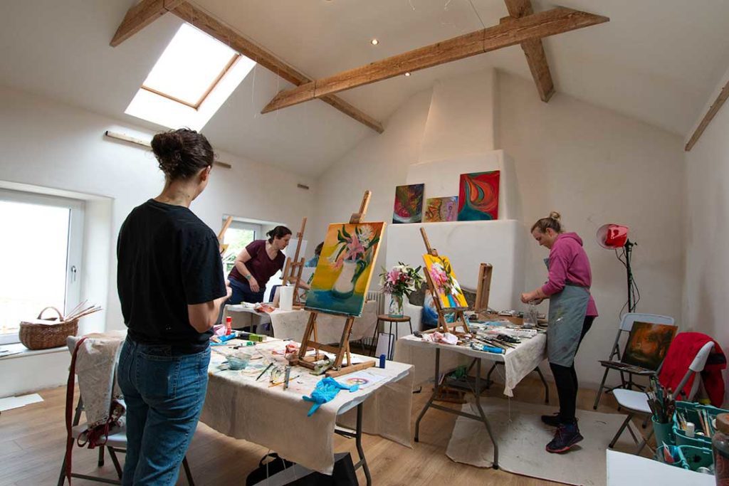 People painting in an artist studio